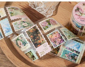Detail of vintage stamp style PET tape with floral patterns on a wooden tray decor