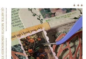 Detailed macro shot of vintage stamp stickers and frames being used with purple tweezers