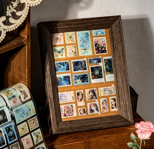 Vintage stamp stickers with floral and butterfly patterns in a wooden photo frame decoration