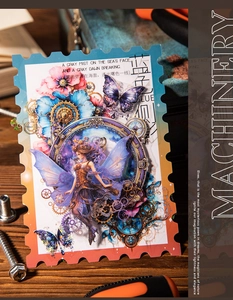 Close-up of steampunk fairy stickers with gears and butterflies on dark wood background