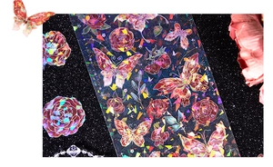 Detail of laser butterfly and rose stickers with a shimmering iridescent shell finish