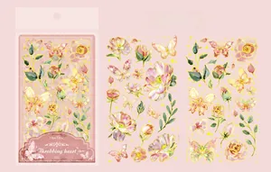 Detail of floral butterfly stickers with gold foil edges for scrapbooking decor