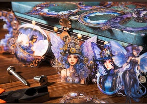 Steampunk fairy stickers with mechanical gears applied to a vintage jewelry box setup