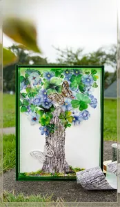 Detailed close-up of tree bark texture and blue floral leaves on decorative DIY stickers