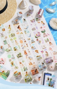 Close-up of summer travel PET tapes with watercolor beach illustrations and shells