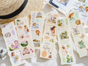 Close-up of travel themed PET stickers with watercolor illustrations and torn paper edges
