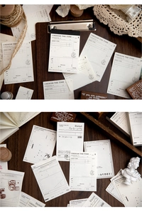 Detail of vintage scrapbooking notes and aesthetic paper ephemera on wood background