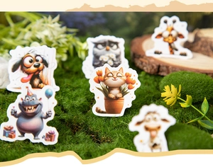 Detailed view of forest animal DIY stickers on moss background for stationery decoration