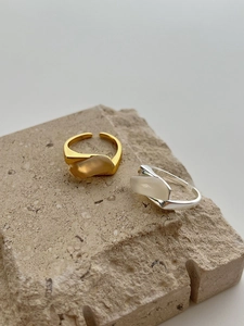 Detail of S925 sterling silver stamp on geometric rings with chalcedony leaves