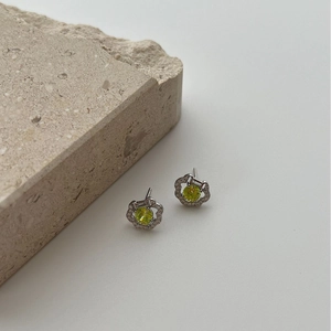 Sunflower silver stud earrings with yellow-green gemstone and halo diamond accents