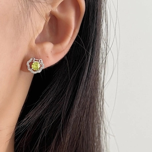 Elegant S925 silver petal stud earrings featuring a yellow-green gemstone and halo diamonds