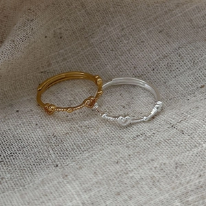 Minimalist 925 sterling silver open ring with three tiny textured hearts in gold and silver