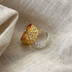 Hammered texture S925 sterling silver open rings in gold and silver set on linen background