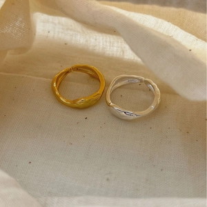 Set of gold and silver minimalist wavy rings with textured hammered surface finish