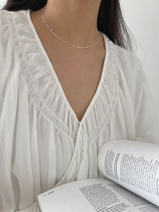 Minimalist S925 sterling silver choker necklace detail on model's collarbone
