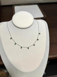 Detail of 925 silver necklace featuring seven round green chalcedony beads on a fine chain