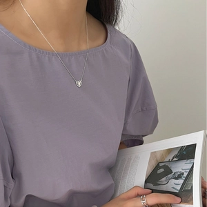 S925 sterling silver heart necklace and hollow ring set on model with minimalist style