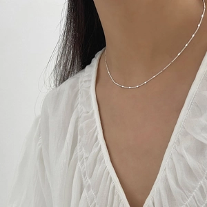 Elegant 925 sterling silver minimalist choker with round sequins on a model
