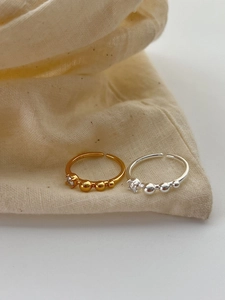 Detailed macro shot of S925 sterling silver beaded rings with zircon stone and hallmark