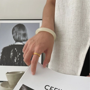 Minimalist double layer matte 925 silver ring on hand with elegant white jade bangle