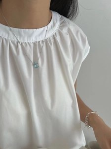925 silver bamboo necklace with blue sapphire water drop pendant worn by model on neck