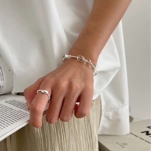 S925 sterling silver beaded ring and crystal bracelet set worn with a minimalist white outfit