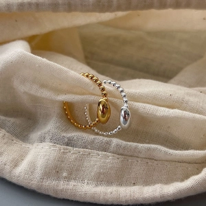 Minimalist beaded S925 silver rings with oval bean accents in gold and silver finish