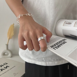 Elegant 925 sterling silver brushed ring with star pattern and clear bead bracelet