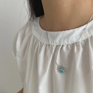 925 sterling silver bamboo chain necklace with light blue pear-cut sapphire pendant