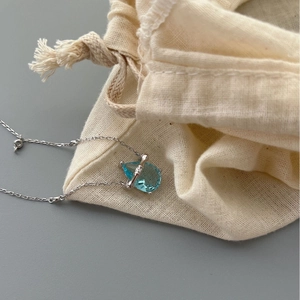 925 silver bamboo chain necklace with a light blue pear-cut sapphire pendant