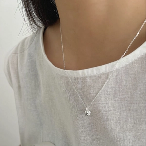 S925 sterling silver minimalist necklace with double heart pendant on a model