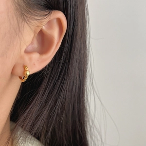 Minimalist S925 silver gold-plated hoop earrings with small bead worn by model