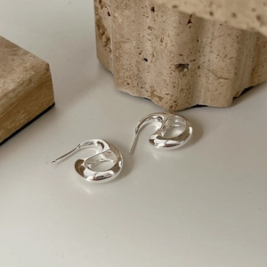 Minimalist 925 silver irregular hollow earrings with high polish on beige travertine stone