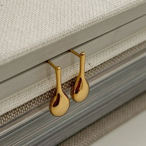 Minimalist gold teardrop earrings with a high-polished finish and elegant curved design