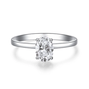 Macro detail of oval cut Paraiba tourmaline ring with classic four-prong silver setting