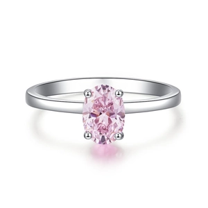 Detailed view of an oval pink gemstone ring in a silver four-prong setting