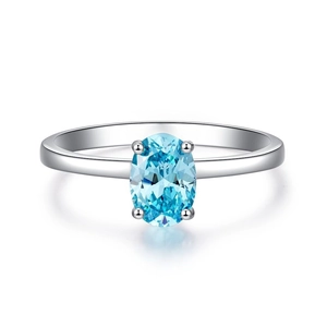 Detailed view of an oval-cut Paraiba blue stone in a four-prong silver setting
