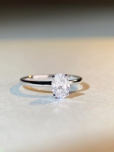 Macro detail of oval cut zircon ring in S925 silver with elegant four-prong setting