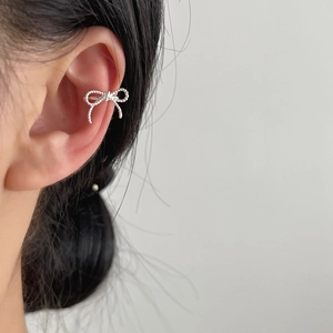 Elegant 925 sterling silver bow ear cuff with a sparkling frosted finish for women