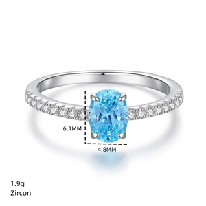 Macro shot of 925 silver ring featuring a 6.1mm oval blue zircon with weight details