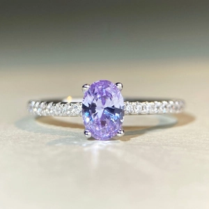 Macro shot of oval purple zircon S925 silver ring with micro-pave setting details
