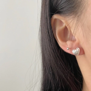 925 Sterling silver heart stud earrings set with vertical stripes worn by a model