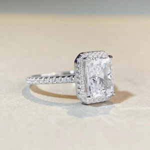 Radiant cut S925 silver engagement ring with square halo and side stone pavé accents