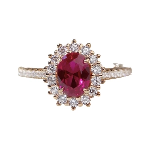 Elegant gold S925 silver ring featuring an oval red ruby and halo of white zircons