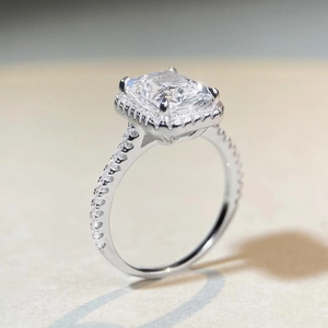 Radiant cut S925 sterling silver halo engagement ring with pavé stones on bands