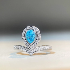 S925 sterling silver pear-cut blue gemstone ring with crown pavé halo and V-shaped band