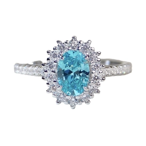 Elegant S925 sterling silver ring with oval aquamarine zircon in halo setting on white background