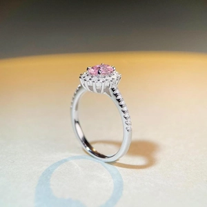 925 silver ring featuring a pink oval gemstone in halo setting with snowflake accents