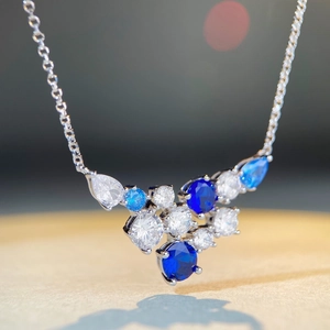 Luxurious S925 sterling silver necklace with blue and white cluster gemstone pendant