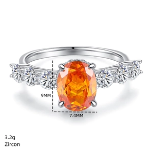 Macro detail of 925 silver ring featuring a 9x7.4mm oval orange zircon and side stones